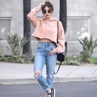 Wear a Cropped Hoodie With High Waisted Jeans and Ankle Boots for a Casual Look